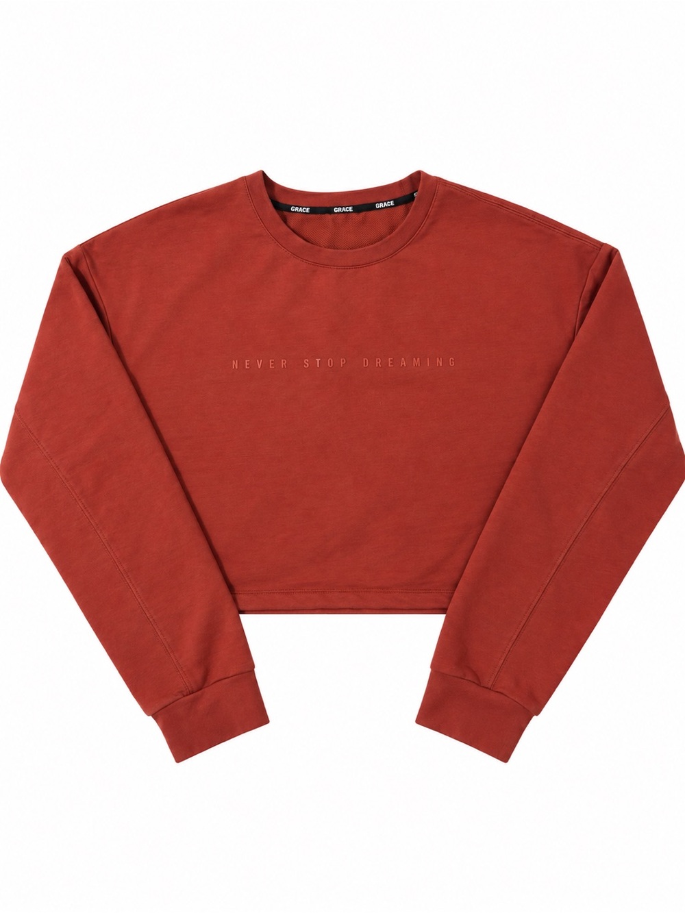 Rust colored Cropped Crewneck Sweatshirt with 'Never Stop Dreaming' Text size m